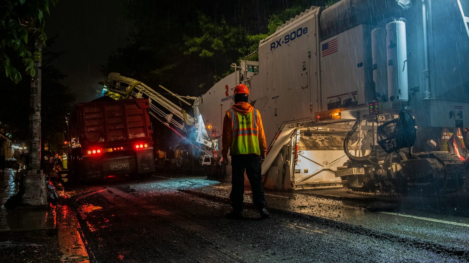 Professional LED Work Torches Guide 1 man wearing orange hard hat standing near truck